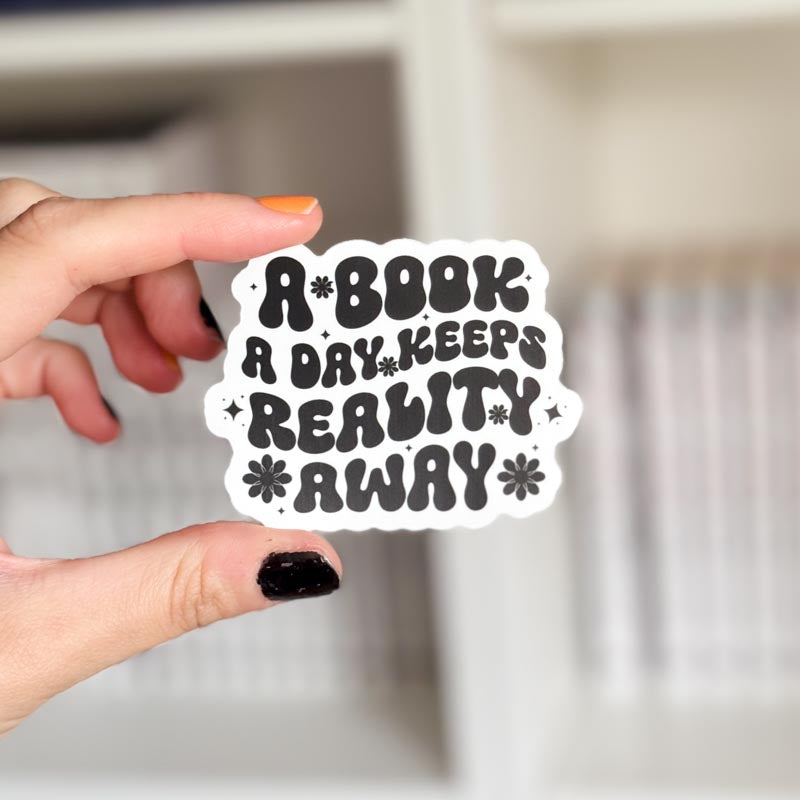 Vinyl sticker - A book a day keeps reality away | Svartvit